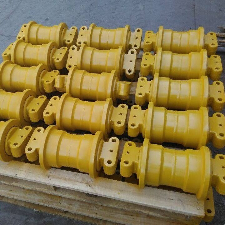 ชิ้นส่วนรถขุดภายใต้แชสซีติดตามลูกกลิ้งบนลูกกลิ้งคนขี้เกียจเฟืองติดตามลูกกลิ้งด้านล่าง